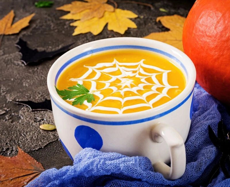 Spooky Pumpkin Soup with Spider Web Topping for Halloween!