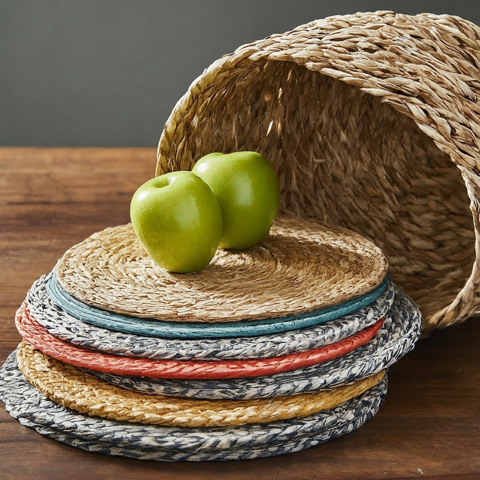 Round placemats in various colors and patterns, adding a stylish touch to a dining table setting. Stack of colorful round placemats, perfect for any occasion.