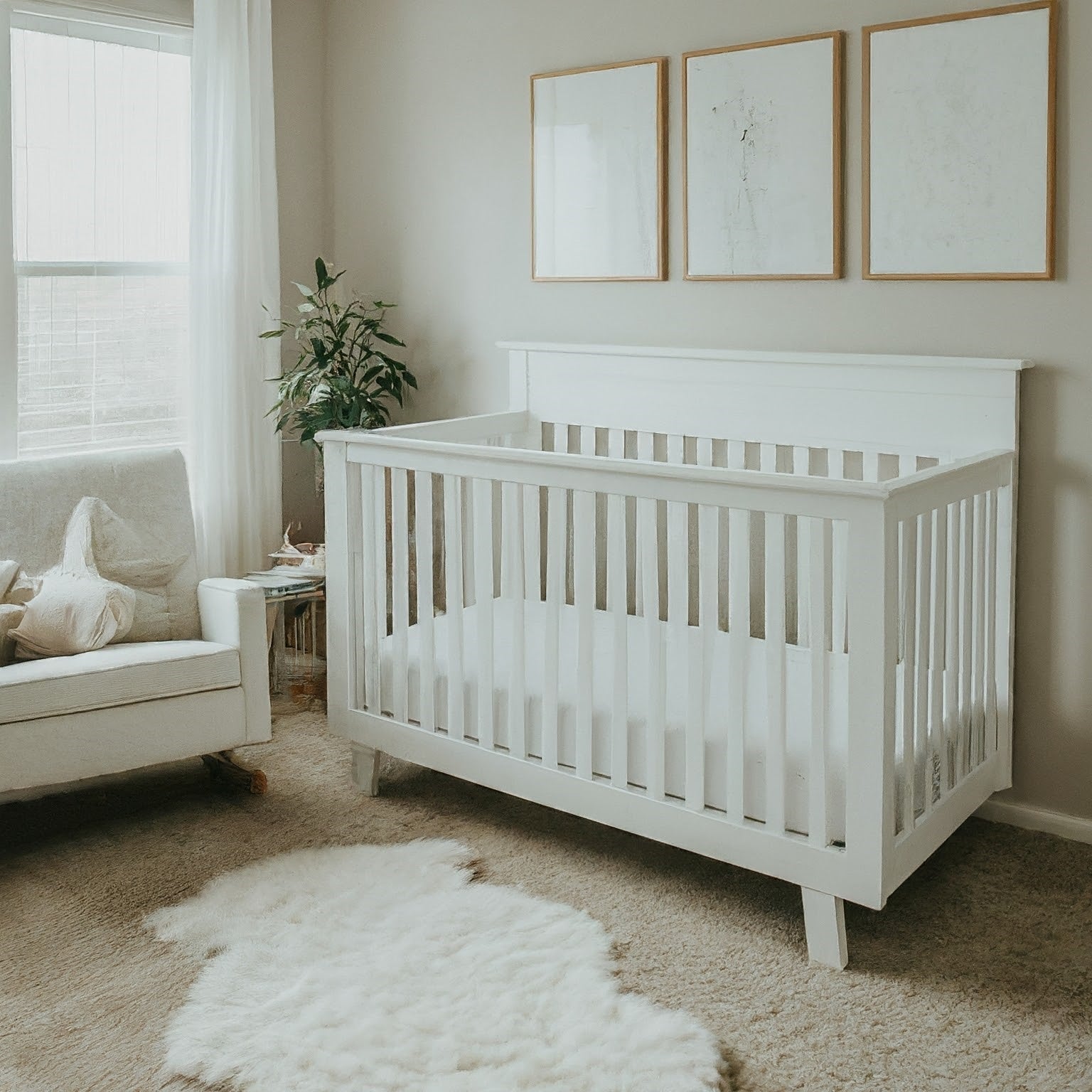 "Minimalist baby nursery featuring a crib with organic cotton crib sheets in neutral tones with simple, elegant patterns. The room has a clean, uncluttered look with modern furniture and a peaceful ambiance