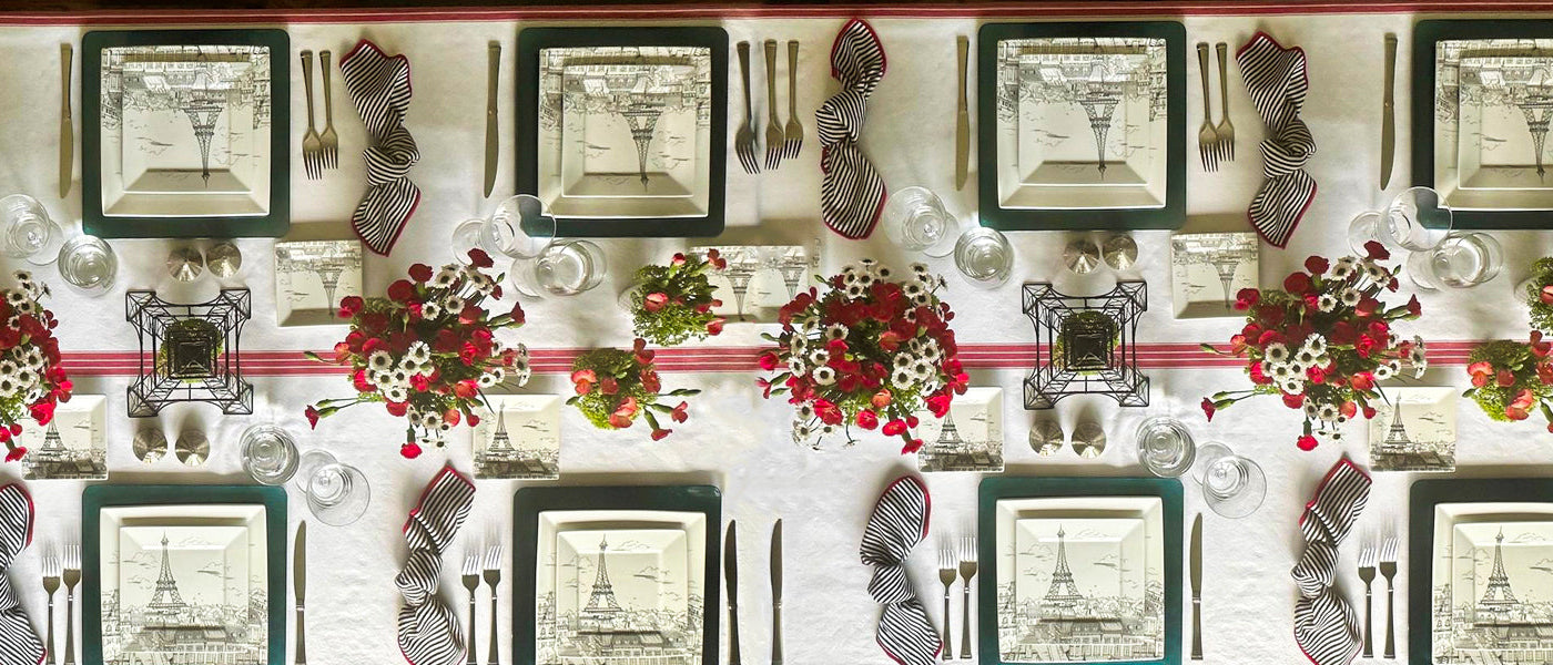 Beautiful kitchen and dining setup featuring tablecloths, napkins, and placemats.