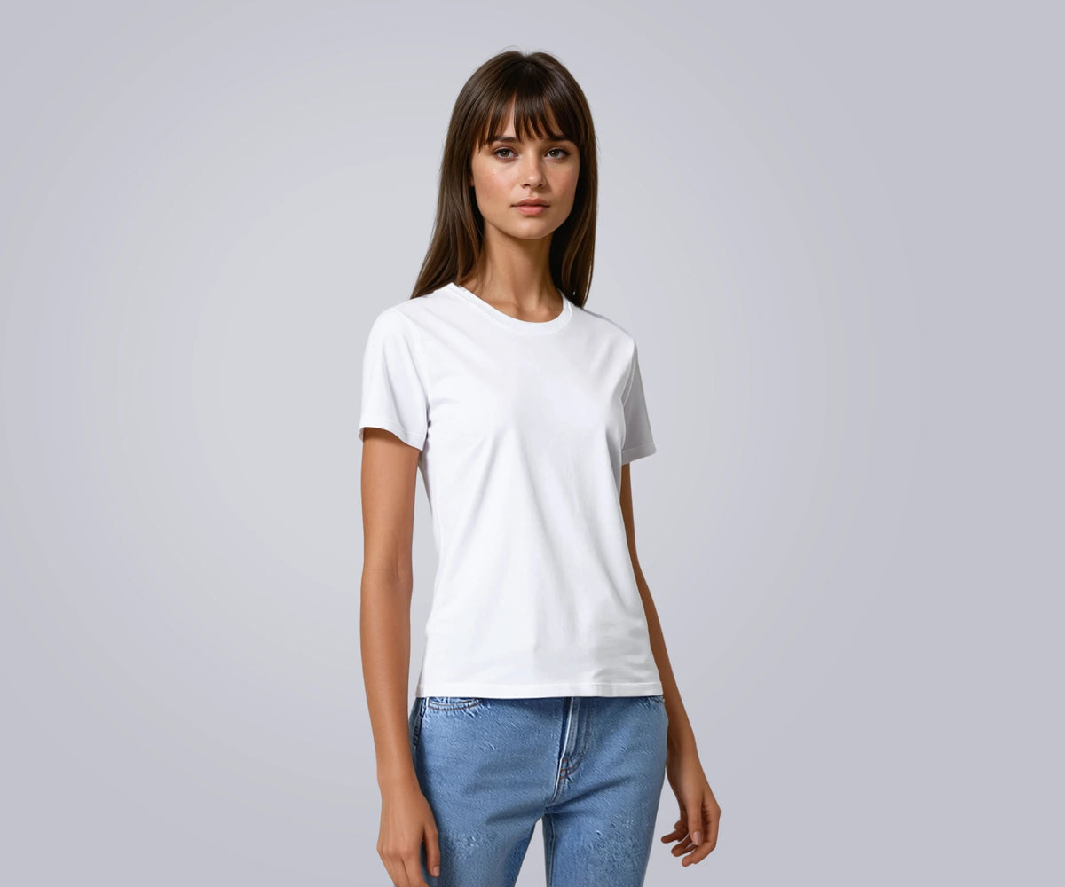 Women's white T-shirt styled with blue jeans