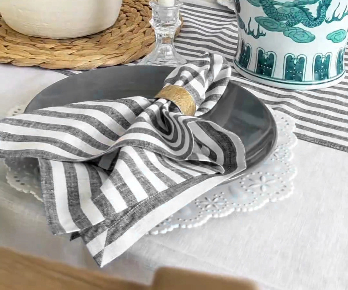 Black and white cloth napkins set the table for a modern dinner party