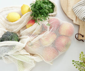 Grocery bags collection - "Folded reusable produce bags placed neatly on a countertop."