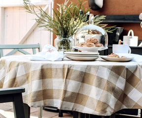 Buffalo plaid table cover for a rustic and inviting look.