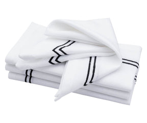 Sophisticated white napkin featuring a trim border