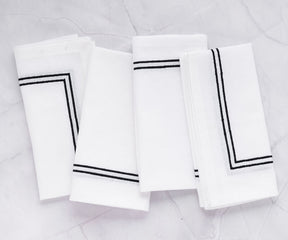 White dining napkin with decorative trim