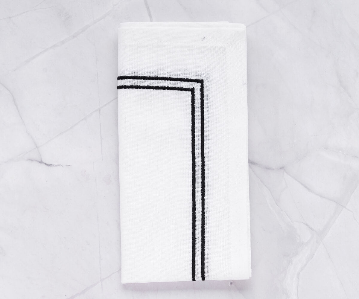 Refined white napkin with a decorative edge trim