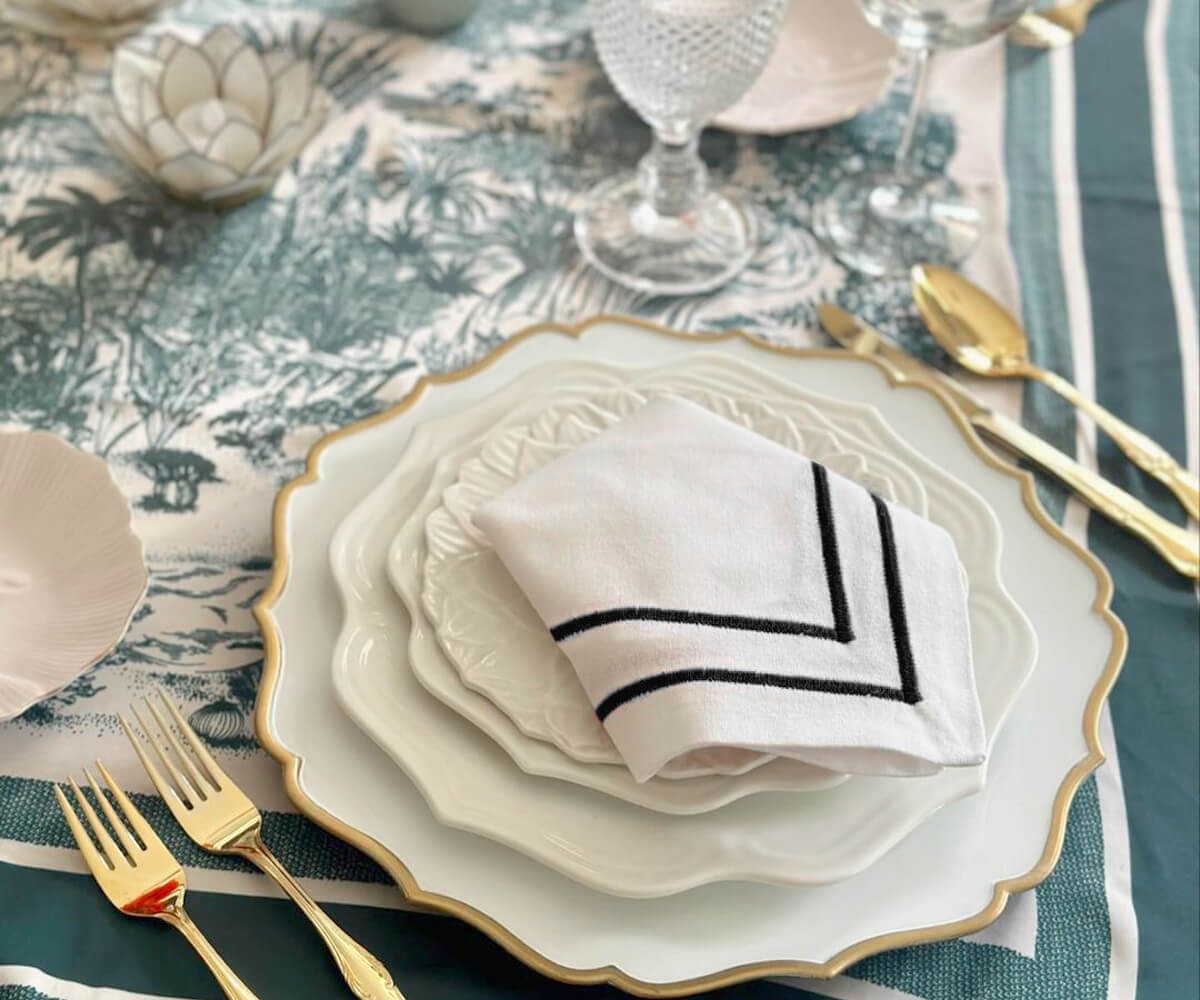 Premium white cloth napkin with an elegant border