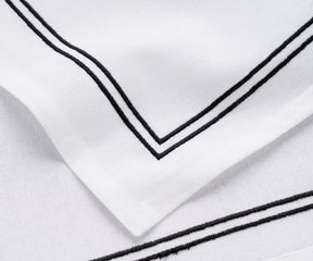 Dinner napkin with a tasteful trim border desig