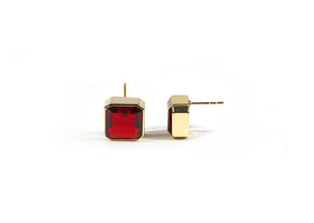 Side view of garnet earrings with secure push-back closure and 18K gold plating.