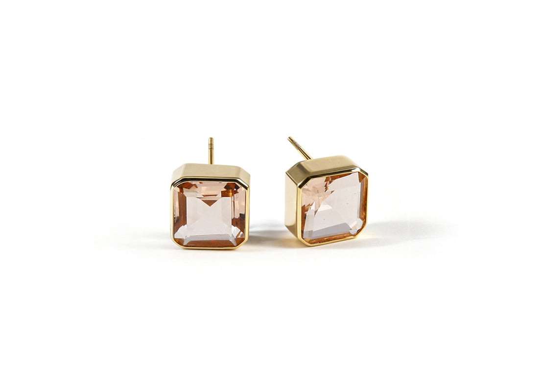 Soft pink blush morganite stud earrings with a 10mm Asscher-cut stone set in 18K gold-plated brass.