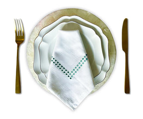 Green and white Christmas-themed cloth napkins