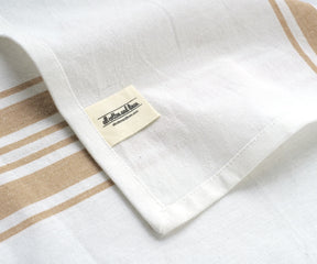 Soft and reusable tan napkins for events.