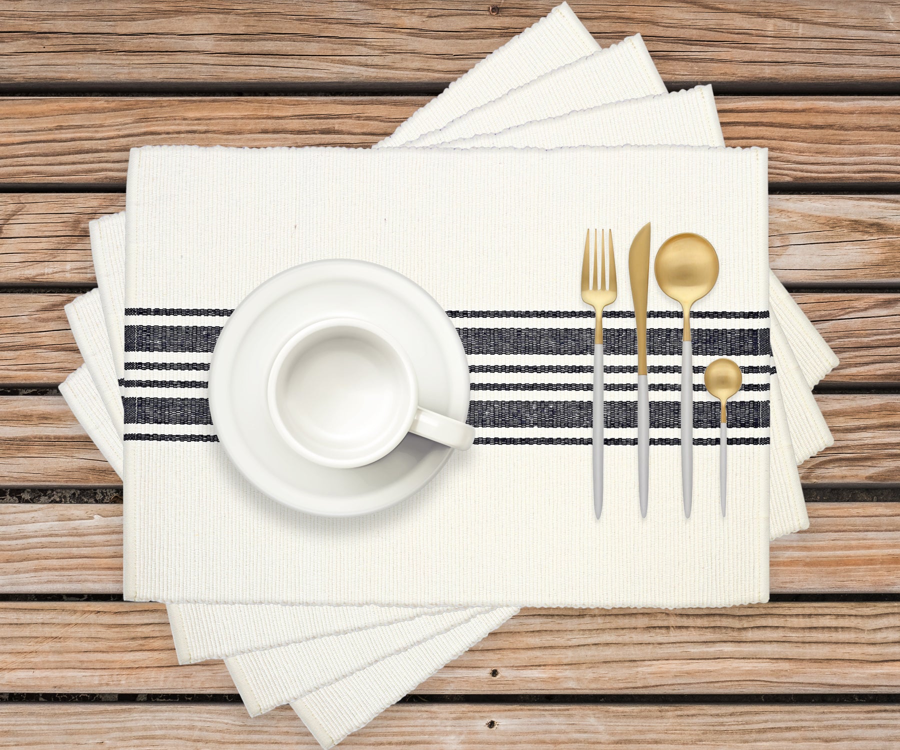 Woven Placemats with navy blue stripes, adding a touch of farmhouse style to a breakfast table.