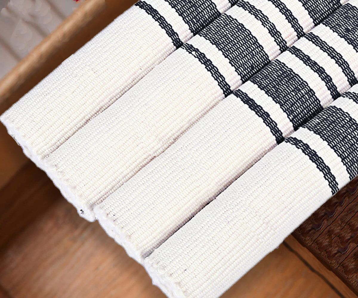 Rolled Navy Blue Country Striped Placemats, white with visible weave and dark blue stripes.