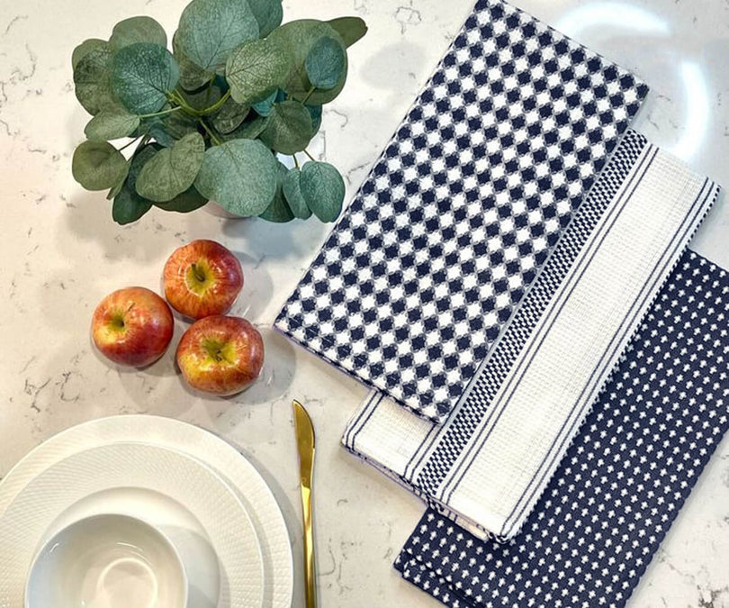 Elegant luxury kitchen towels with a high-quality fabric, neatly arranged or hanging in a stylish kitchen.