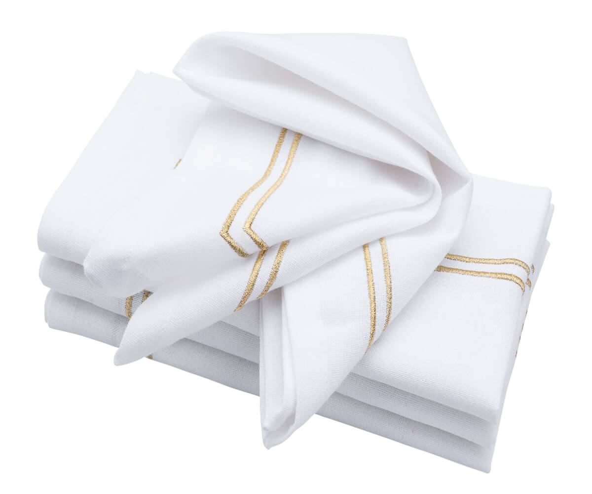 Luxurious white napkin accented with a gold trim border