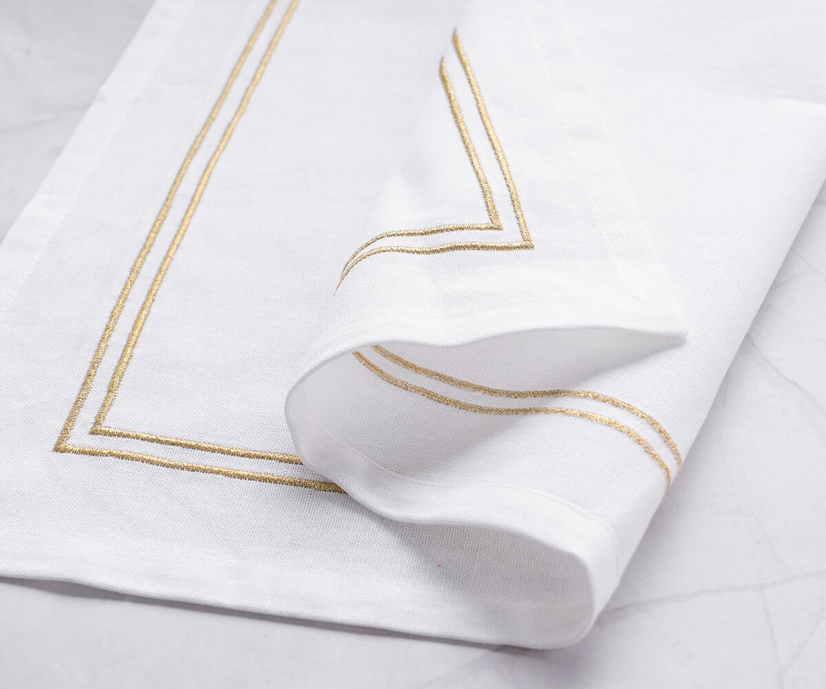 White dinner napkin enhanced with a beautiful trim border