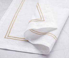 White dinner napkin enhanced with a beautiful trim border