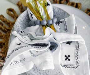 Embroidered cotton napkin in white for formal table settings
