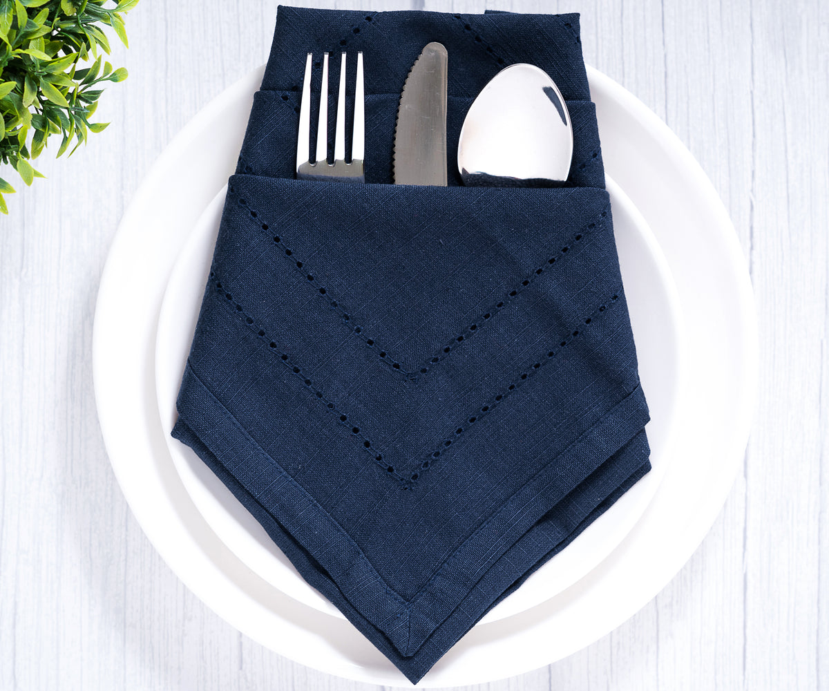 Double hemstitched linen napkin with intricate stitching for formal dining