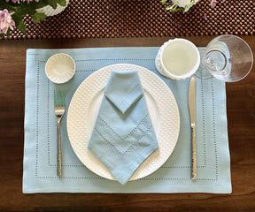 Light Blue hemstitched napkins with decorative stitching along the edges.