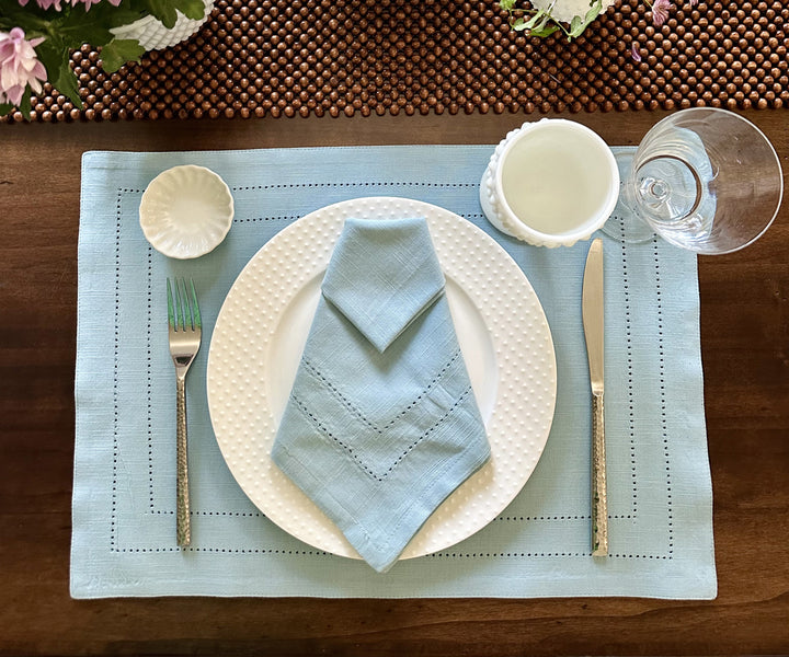 Light Blue hemstitched napkins with decorative stitching along the edges.