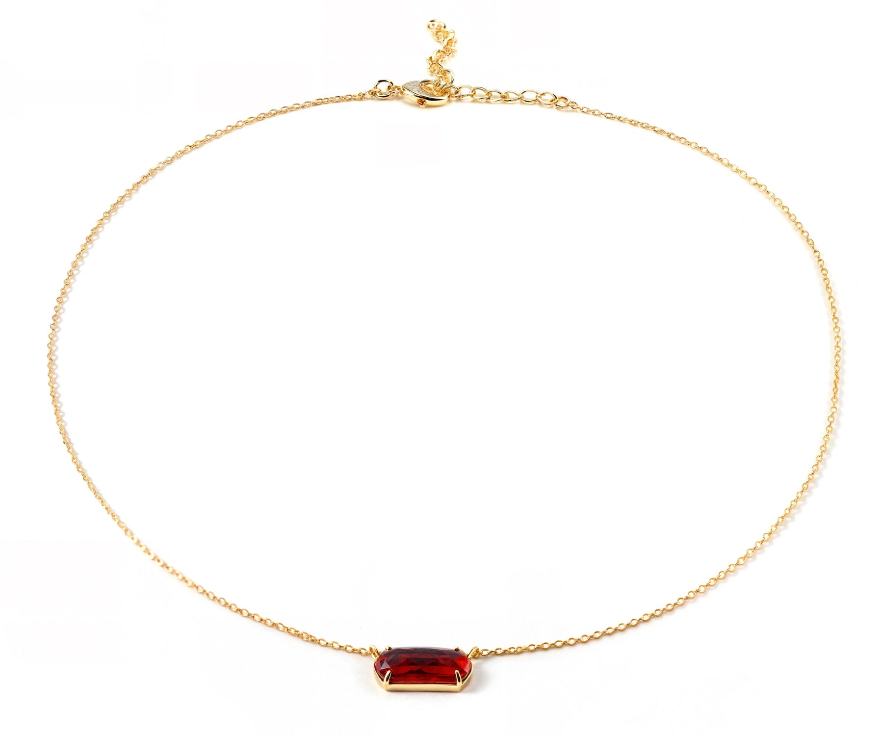 Gold chain necklace with green emerald quartz pendant.