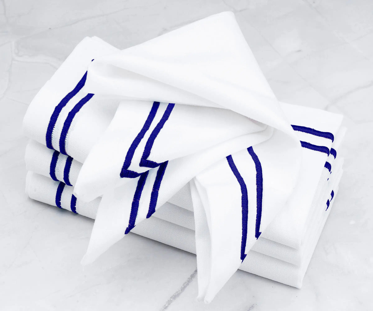  Royal blue double-line embroidered napkins.