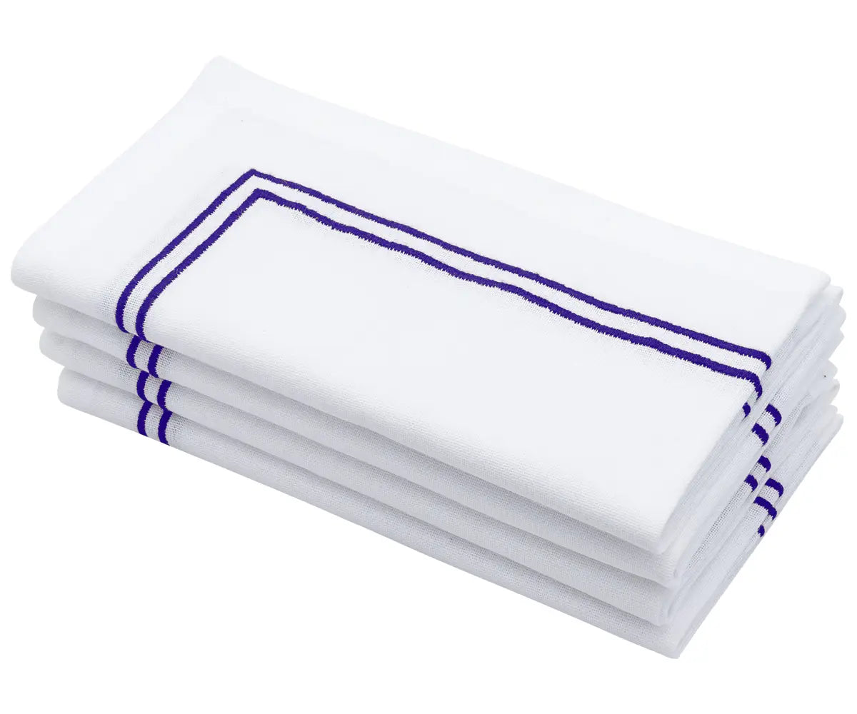 Royal blue napkin with double line embroidery detail.