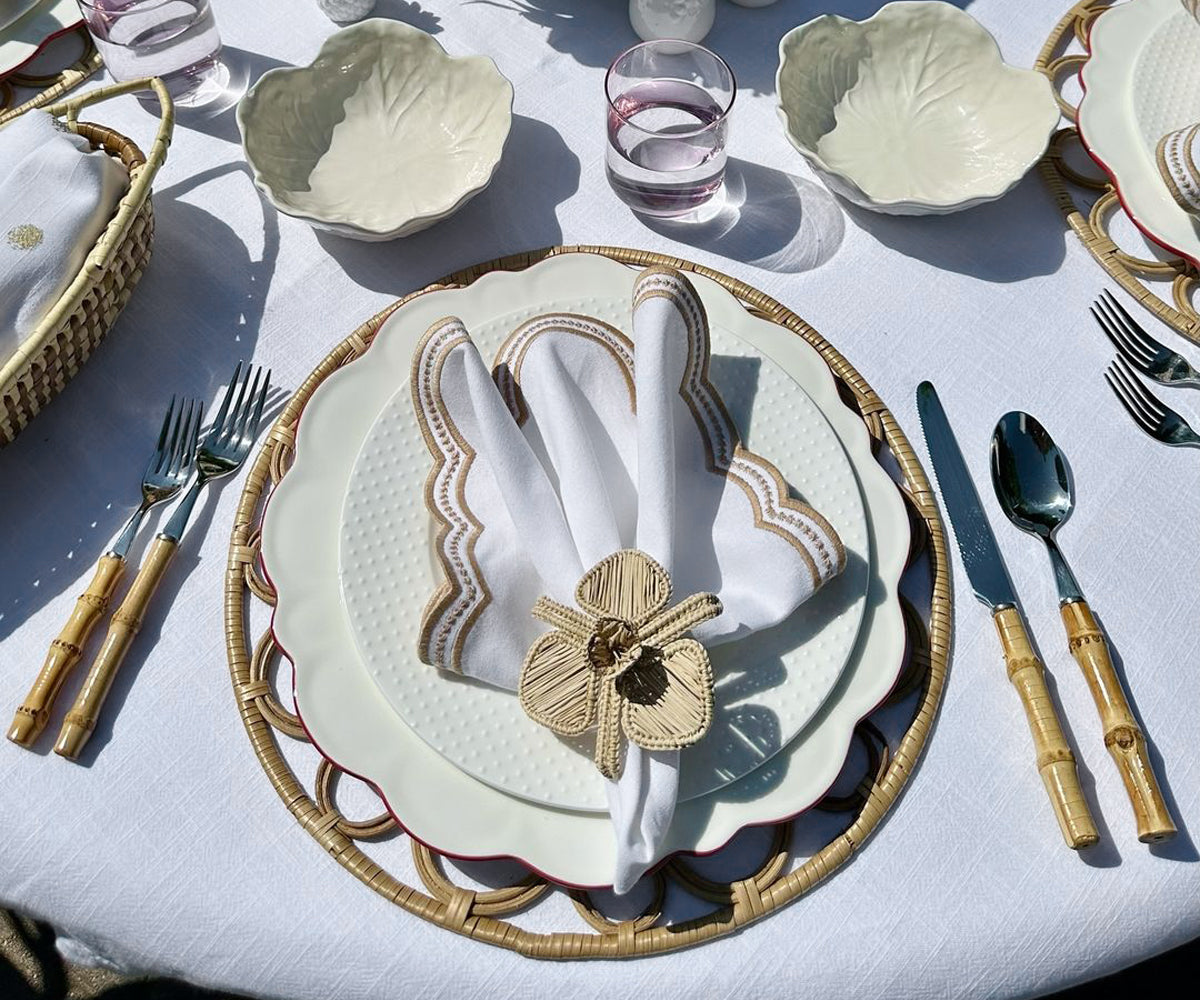 Beige scallop napkins paired with vintage tableware, creating a classic and timeless table setting.