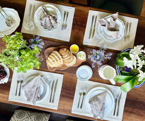 Sophisticated beige scallop napkins at a garden party table setting