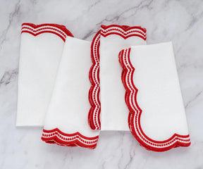 Luxury red scalloped embroidered napkins, ideal for holiday table settings and special occasions.