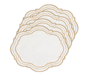 Oval placemat with a dotted pattern in white and beige, styled under sleek tableware.