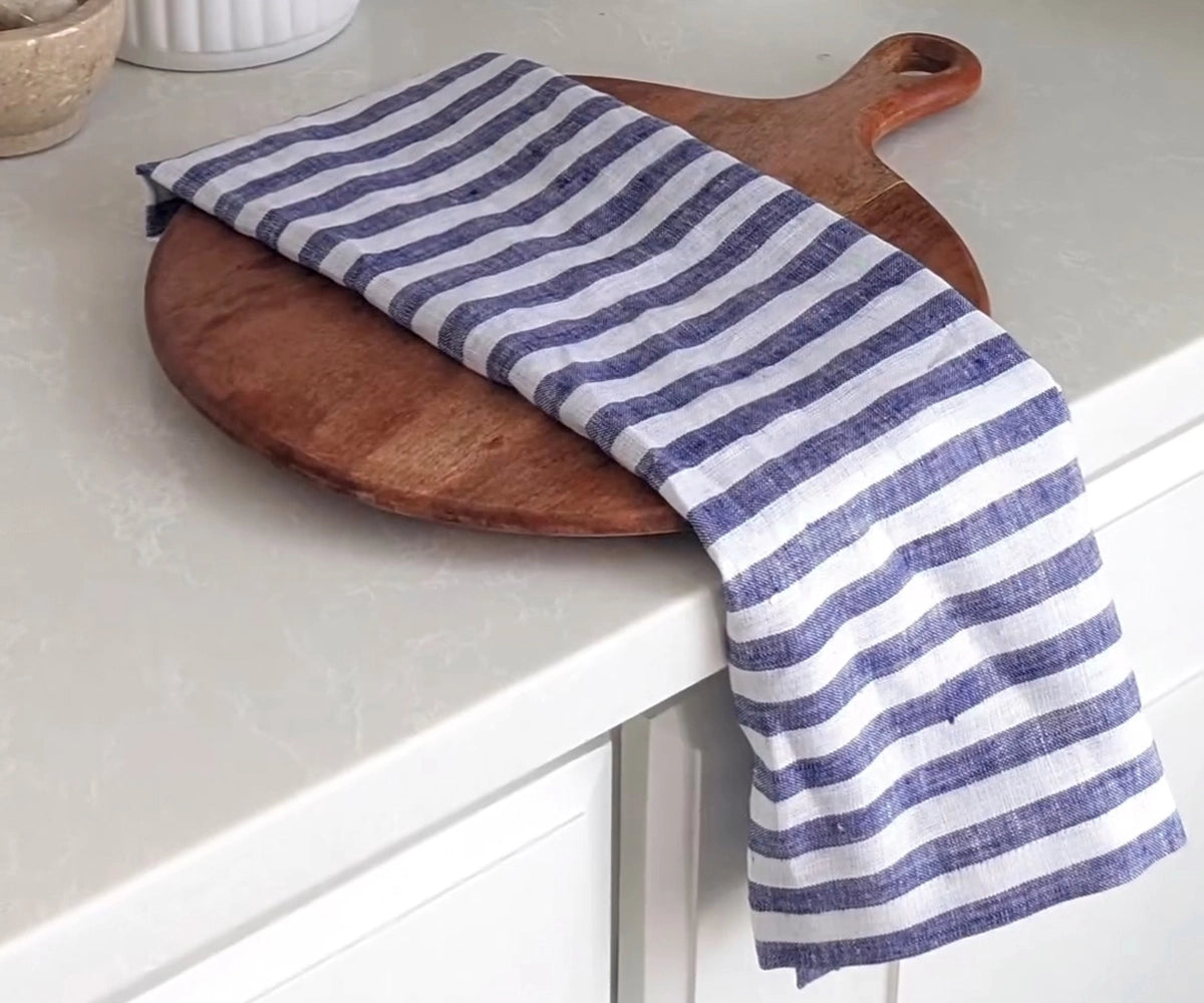 Blue and white cloth napkins for a minimalist table setting
