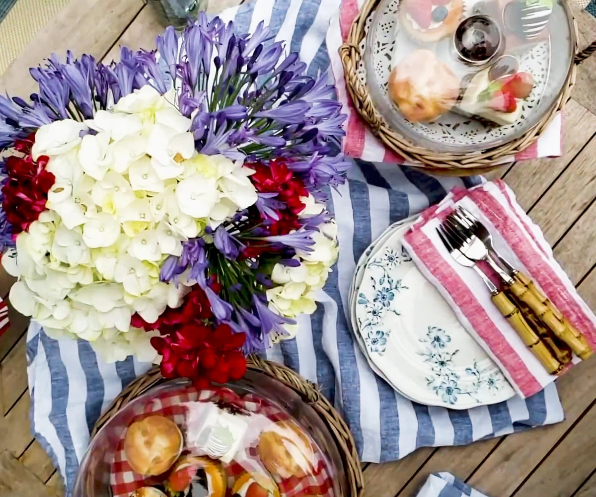 fancy linen napkins tied with twine, placed on a wooden tray, showcasing their eco-friendly, reusable nature.