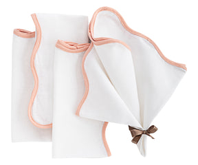 scallop edge napkins with a textured weave, offering style and functionality for dining.