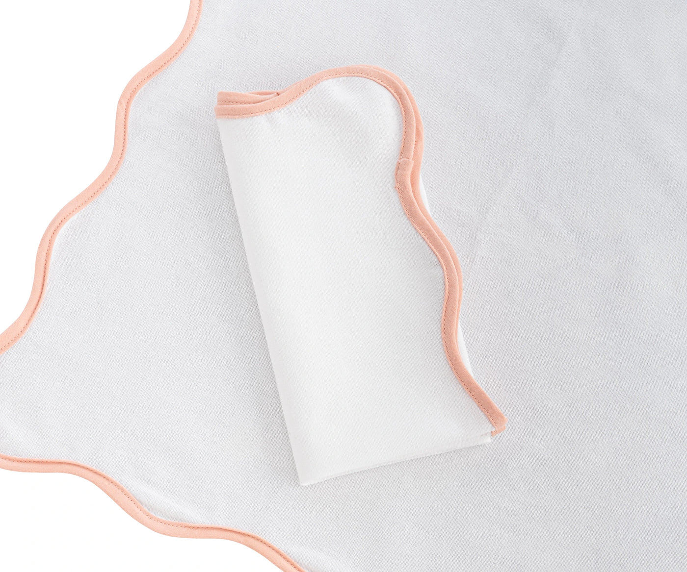 cotton napkin with a smooth finish, adding elegance to any table setting.