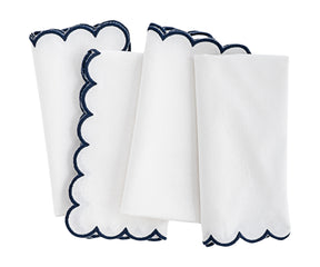 scalloped napkin with contrasting border stitch.