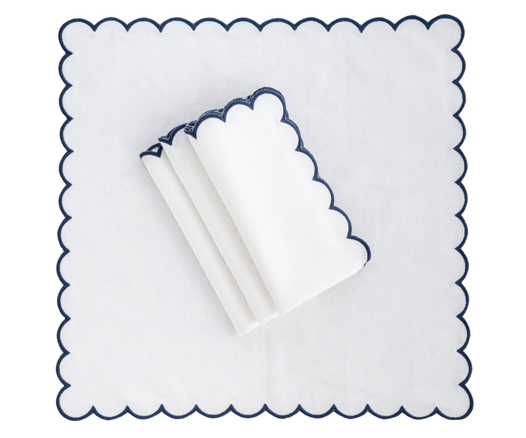 Elegant white napkin with scalloped edges, neatly folded