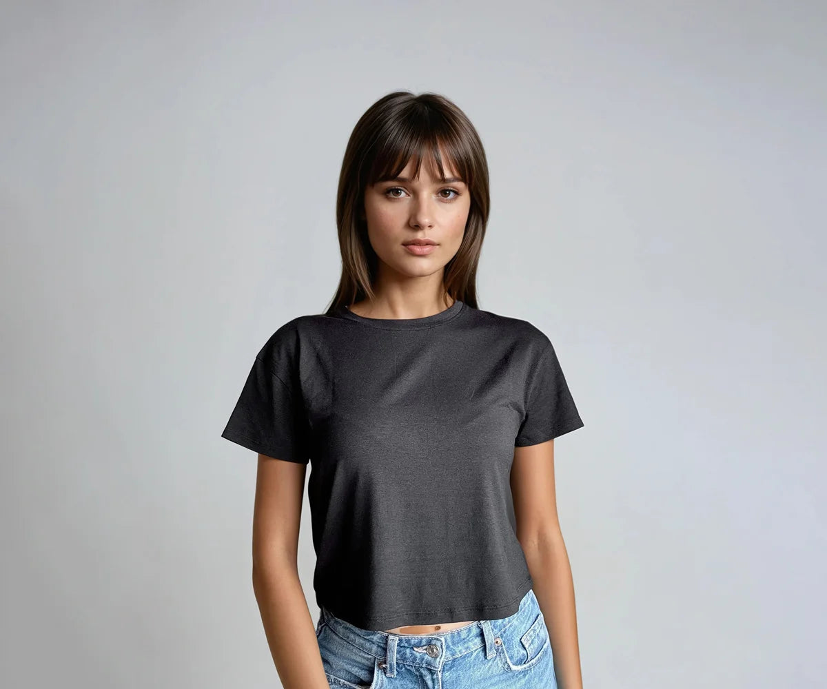 Woman wearing a black crop top with short sleeves