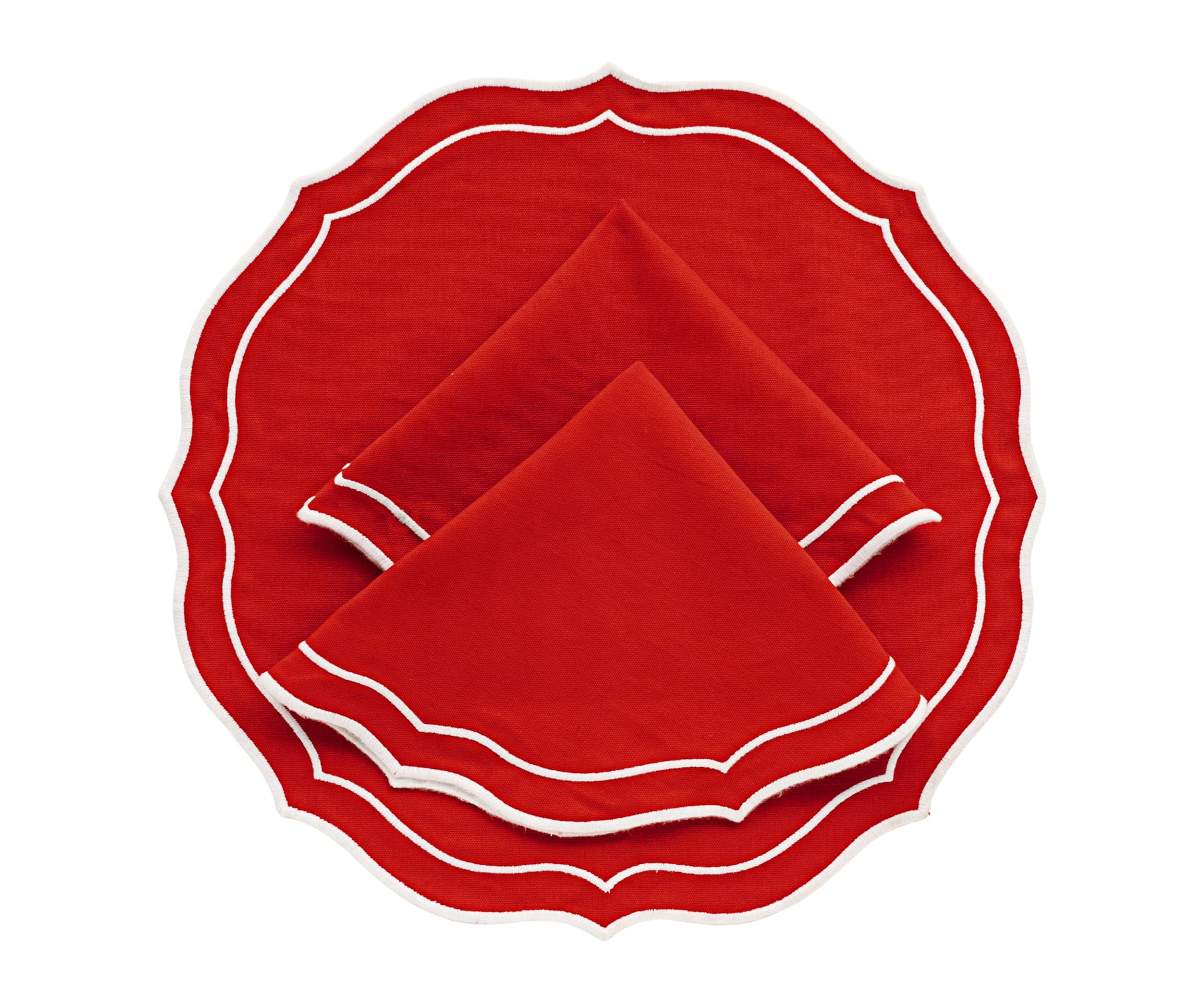 red round placemat with a textured weave, adding a vibrant accent to the table.