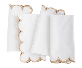 A folded cloth napkin with a scalloped edge.