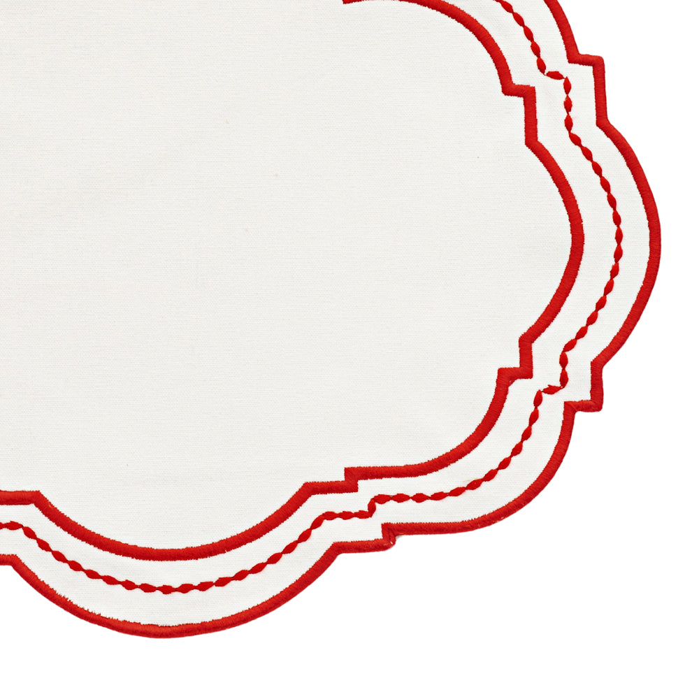 red oval placemat with embossed dot detailing, perfect for minimalist decor.