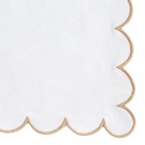 Minimalist napkin design with subtle scalloped detail in soft beige.