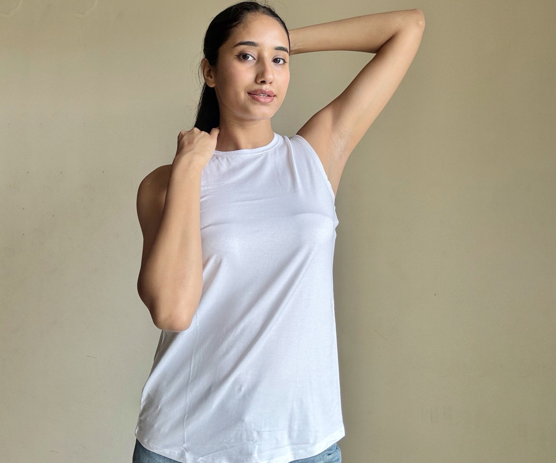 "Image of women's tank tops in various styles, featuring classic white tank tops and sleek black tank tops, ideal for casual and versatile wear.