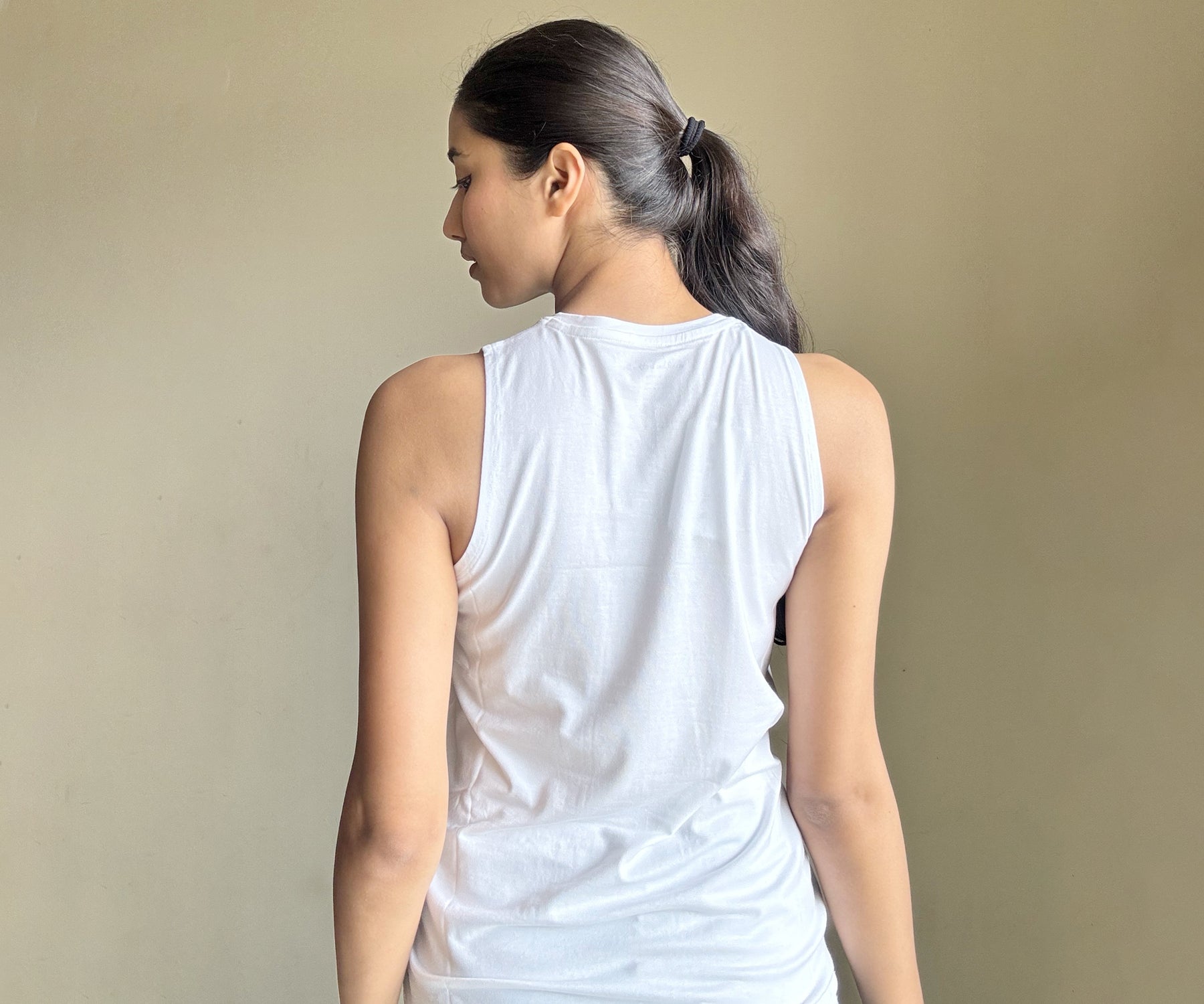 Collection of tank tops, including both black and white options, emphasizing popular wardrobe staples for women's casual attire.