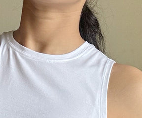 Assortment of women's tank tops featuring classic white and black colors, ideal for layering or standalone wear.