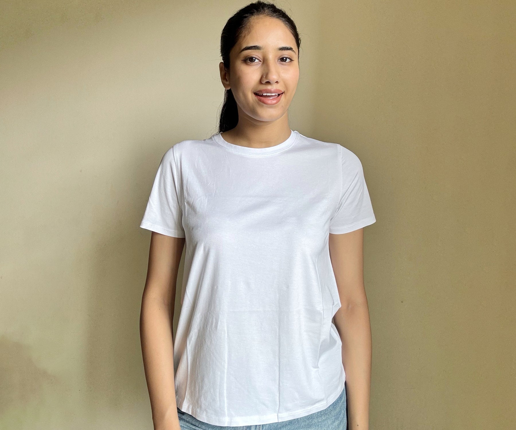 Assortment of women's t-shirts, featuring classic, white, and black tees as well as oversized and tight fits, designed for versatile wardrobe options.